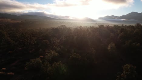 Lovell-canyon-red-rock-formation-California-aerial-cinematic-footage-at-sunset-with-epic-sunshine-and-mountains-scenic-landscape