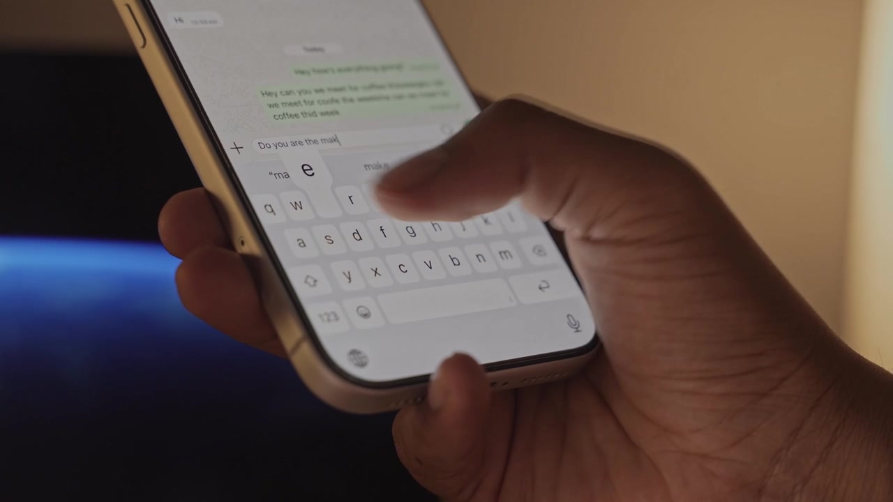 Man hands chatting and typing on smartphone macro closeup. Unrecognizable human typing text message tapping touchscreen keyboard using whatsapp application a social media.