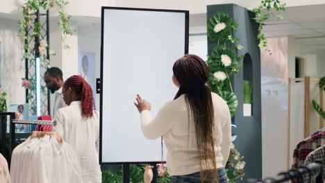 man uses mockup ar screen in thrift shop