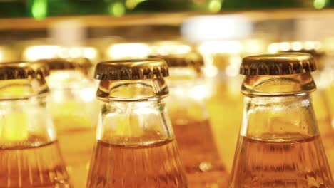 close up of a row of beer bottles