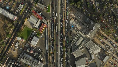 drone: top-down view of traffic at guadalajara city gomez morin avenue
