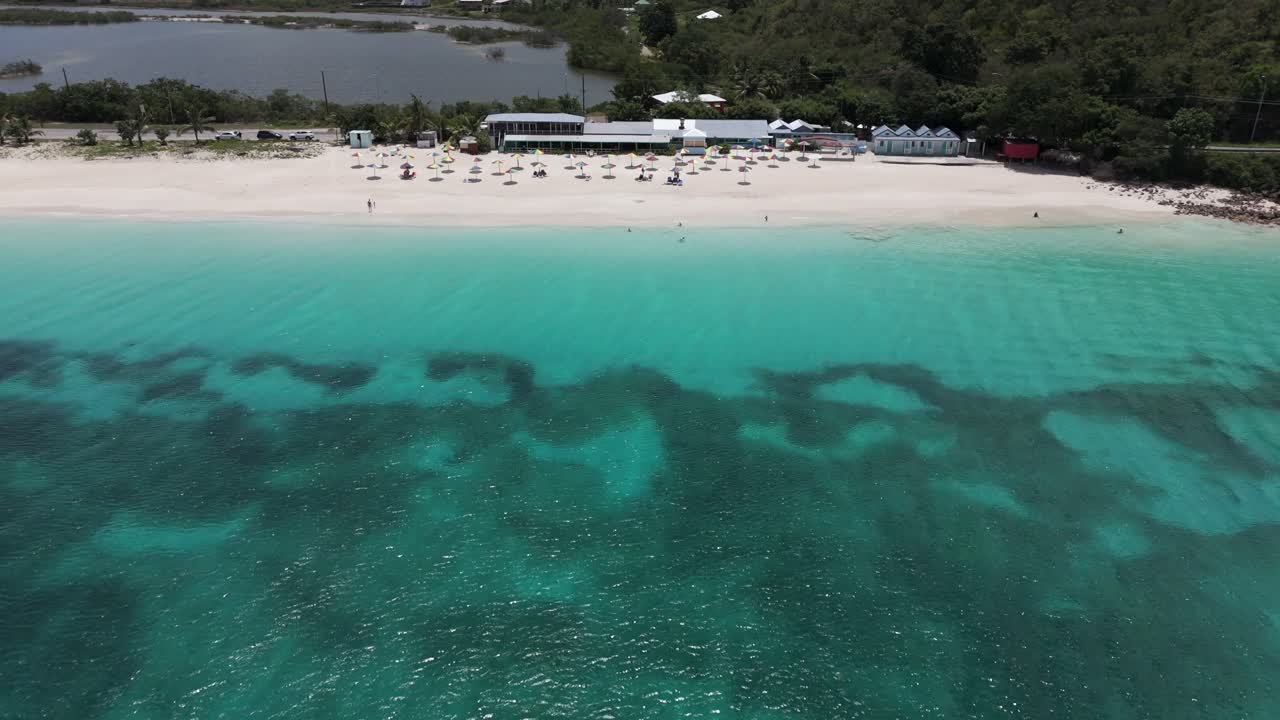 Darkwood Beach Bar And Restaurant On The Valley Road In Antigua And Barbuda. Aerial Pullback Shot