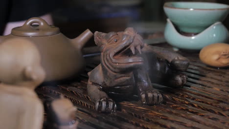 traditional chinese tea ceremony with dragon sculpture