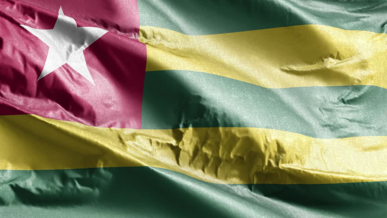 Togo textile flag waving on the wind loop. Togo banner swaying on the breeze. Fabric textile tissue. Full filling background. 10 seconds loop.