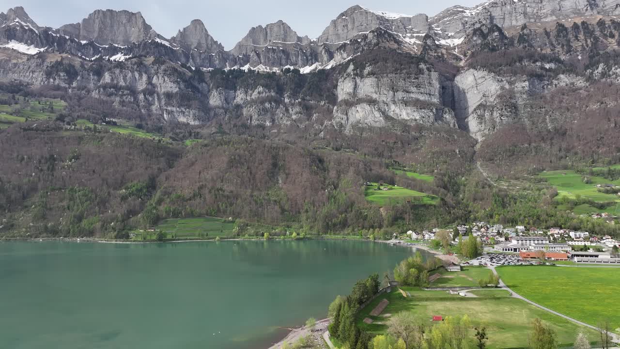 Lush lakeside view of Walensee with Churfirsten backdrop, Swiss splendor - aerial panoramic