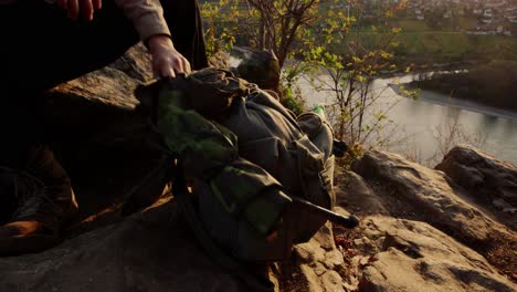 Hiker-Removing-Coffee-Pot-Out-Of-His-Backpack-To-Enjoy-Coffee-In-Peaceful-Nature,-Dürnstein