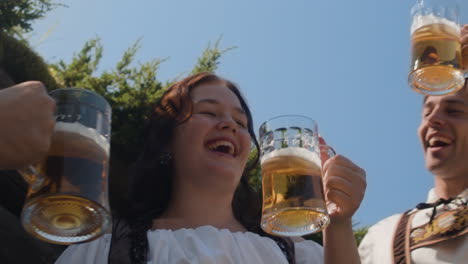 people celebrating oktoberfest with beer