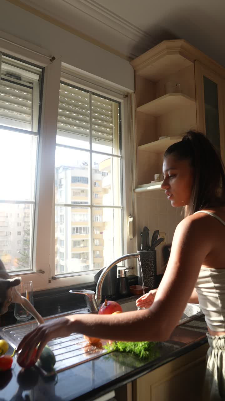 Cat Watching Food Preparation in a Kitchen