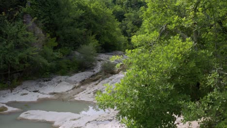 Aerial:-mountainside-stream-falls-flowing-down-Croatian-rocky-hillside