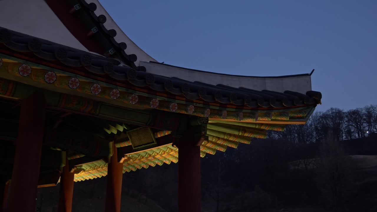 Gongju Gongsanseong Fortress - Traditional Ornate Eaves And Curved Tiles In Twilight - Gongju, South Chungcheong Province, South Korea. low angle, panning shot
