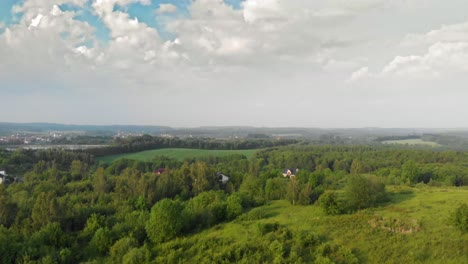 Aerial-shot-of-a-green-meadow-in-pomeranian-district-in-Poland