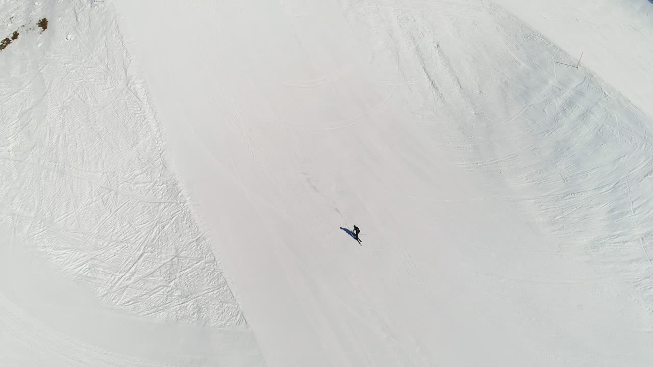 Dynamic freestyle skier throwing big airs and stylish tricks on rails at Laax Snowpark, Switzerland—capturing high-level performance, style, and action in a world-class winter setting.