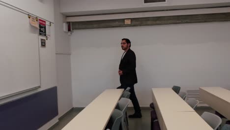 university professor enters lecture room
