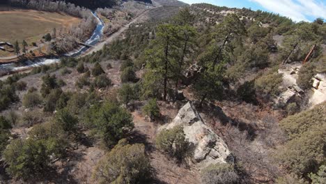 4k fpv down towards bridge and mountain