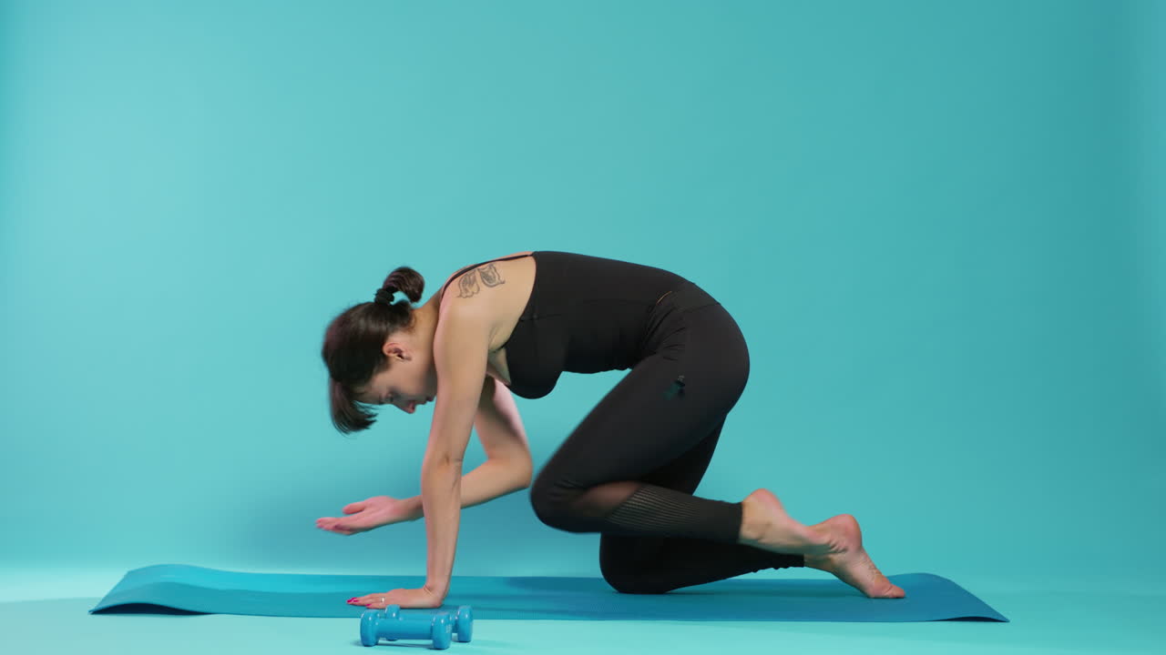 Athlete doing physical workout exercise in front of camera