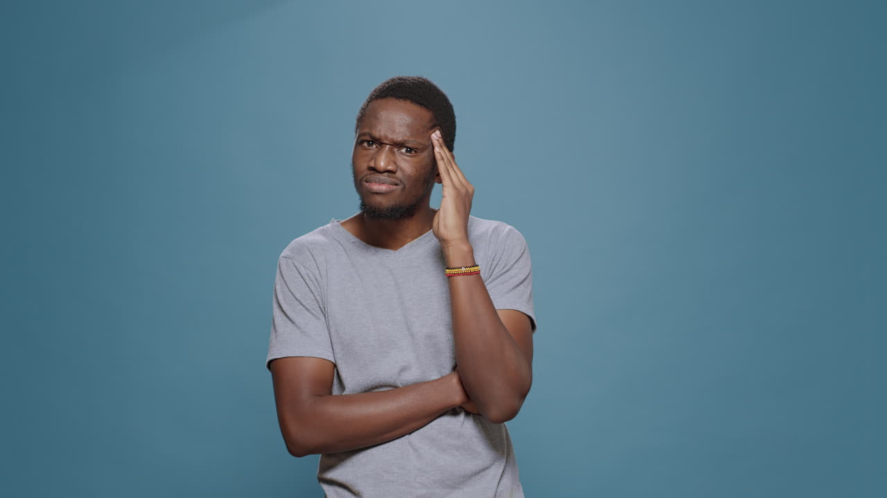 Pensive model brainstorming ideas to find solution in front of camera