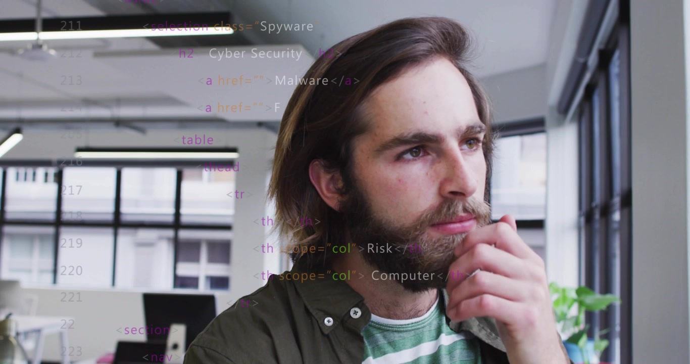 Software professional gazing out window as HTML code starting scrolling cybersecurity terms