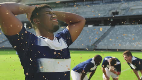 animación de confeti cayendo sobre un jugador de rugby afroamericano.
