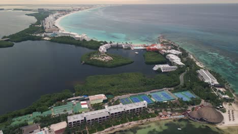 aerial-view-of-Beachfront-Hotel-with-Swimming-Pool-in-Cancun,-Mexico-in-hotel-zone