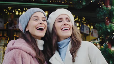 handheld view of friends spending time on christmas market