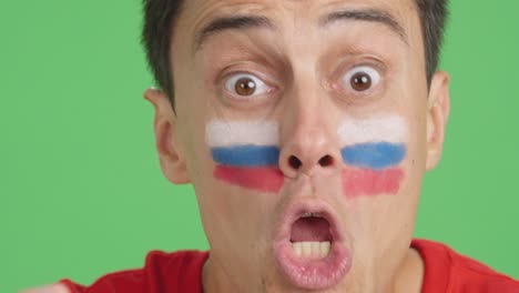 close up of a man supporting russian team