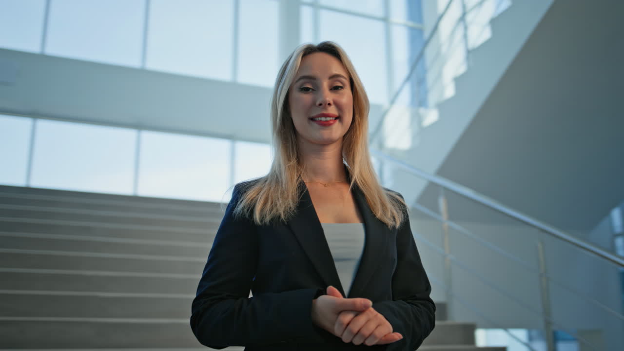 Woman executive smiling camera standing at staircase closeup. Confident lady