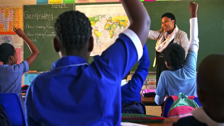 Schoolchildren and teacher in a lesson at a township school 4k
