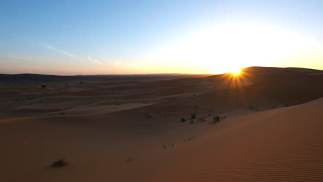 sunrise in the sahara desert near merzouga, morocco