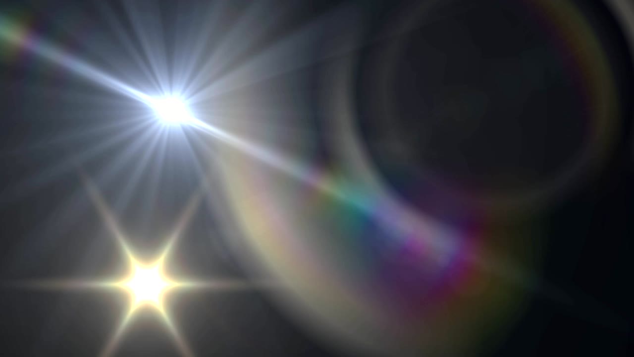 mancha de luz y destello de la lente contra un fondo negro