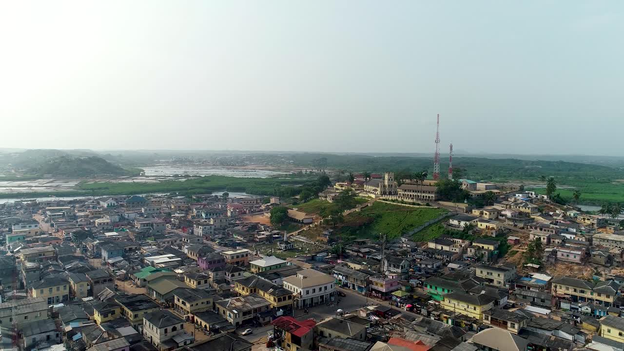 A 4k drone shot revealing a town after flying over the fort