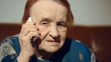 elderly woman talking on the cell phone