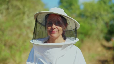 beekeepers in protective suits in a natural environment
