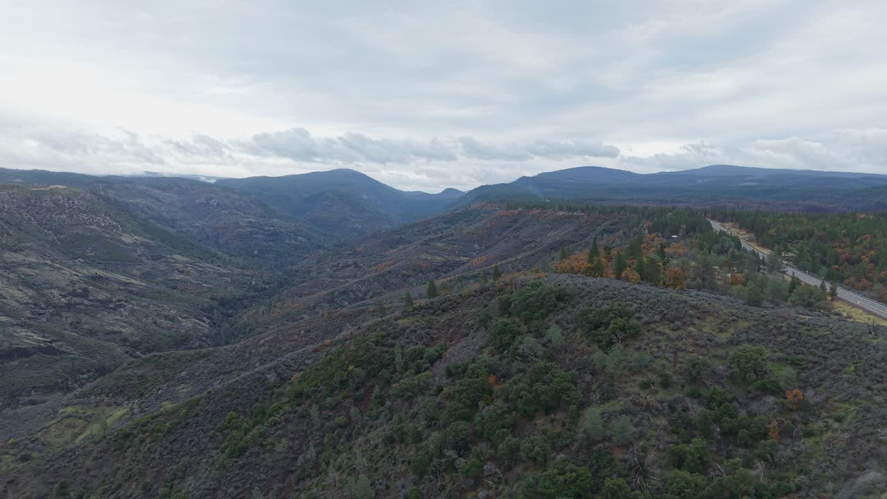 The drone glides across Paynes Creek Point, offering a broad look at rolling terrain and subtle movement of the surrounding wilderness