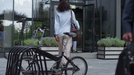 office manager using electric scooter commute to work. corporate people concept.