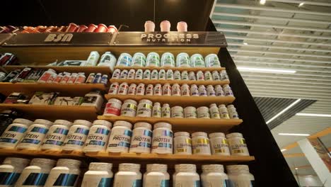 sport nutrition store interior with large choice of nutritional supplements.