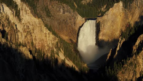 artist point in yellowstone national park lower falls at sunrise golden hour