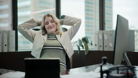 businesswoman in office with tablet and computer