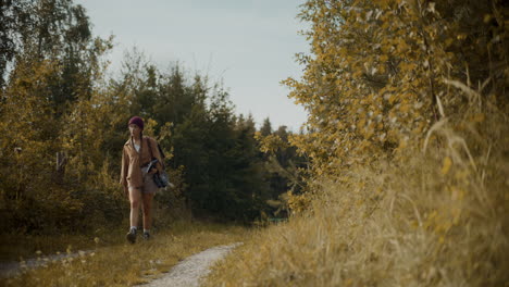 female explorer looking around while exploring in forest