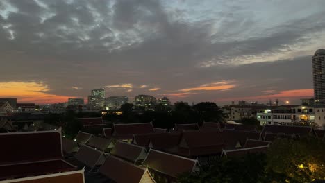 Bangkok-Thailand-Southeast-Asia-buddhist-monks-houses,-city-and-sky-golden-hour