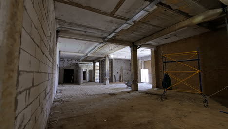 new building project site. empty space in a construction site shows unfinished walls and scaffolding during the development of a structure