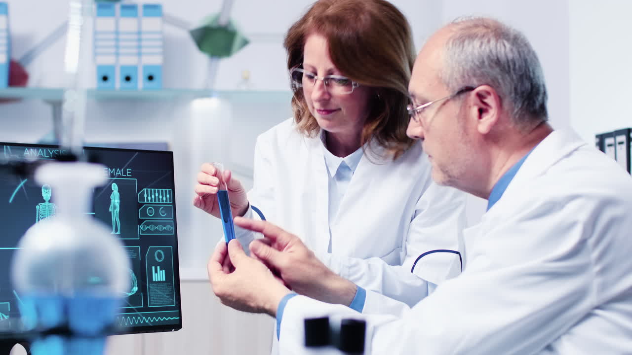 Scientists working in a lab analyzing a test tube