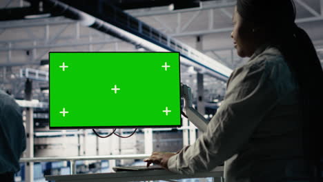 server room female programmer using green screen computer