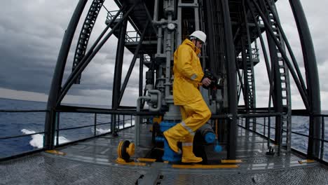 offshore oil rig worker performing maintenance