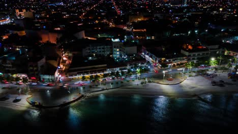 hyperlapse at night parallel to la paz bay with reflections in the sea