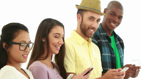 creative business team using their phones in a row