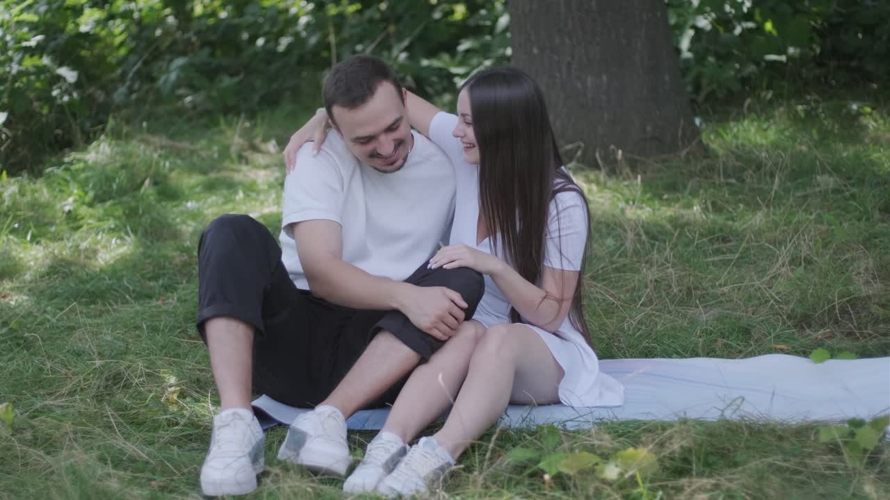 Couple enjoying a romantic picnic in the park
