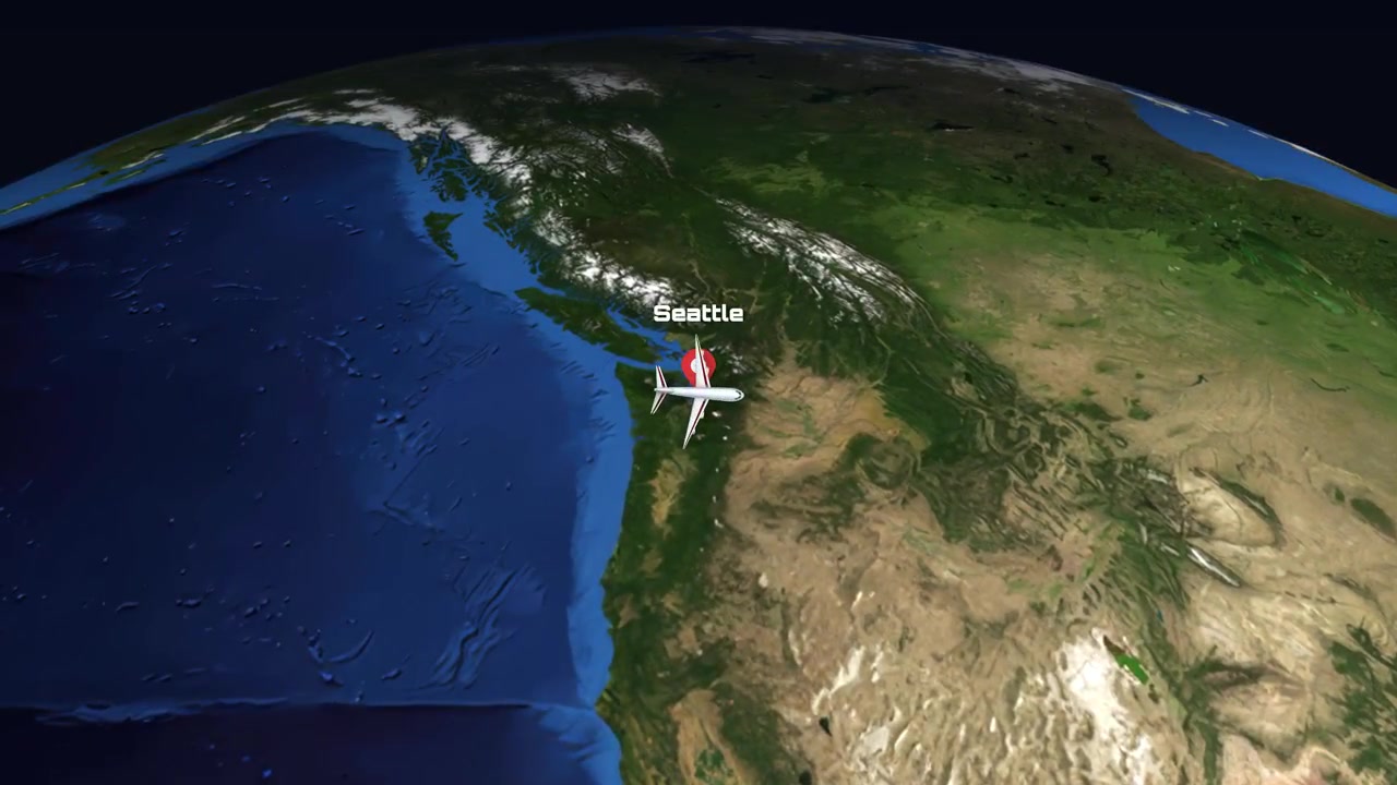 Satellite view animation tracks a commercial airplane flying from Seattle to Charlotte across North America