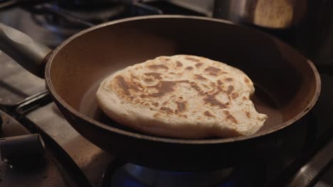 white flour bread baked at home in a pan until golden brown. food preparation in the kitchen