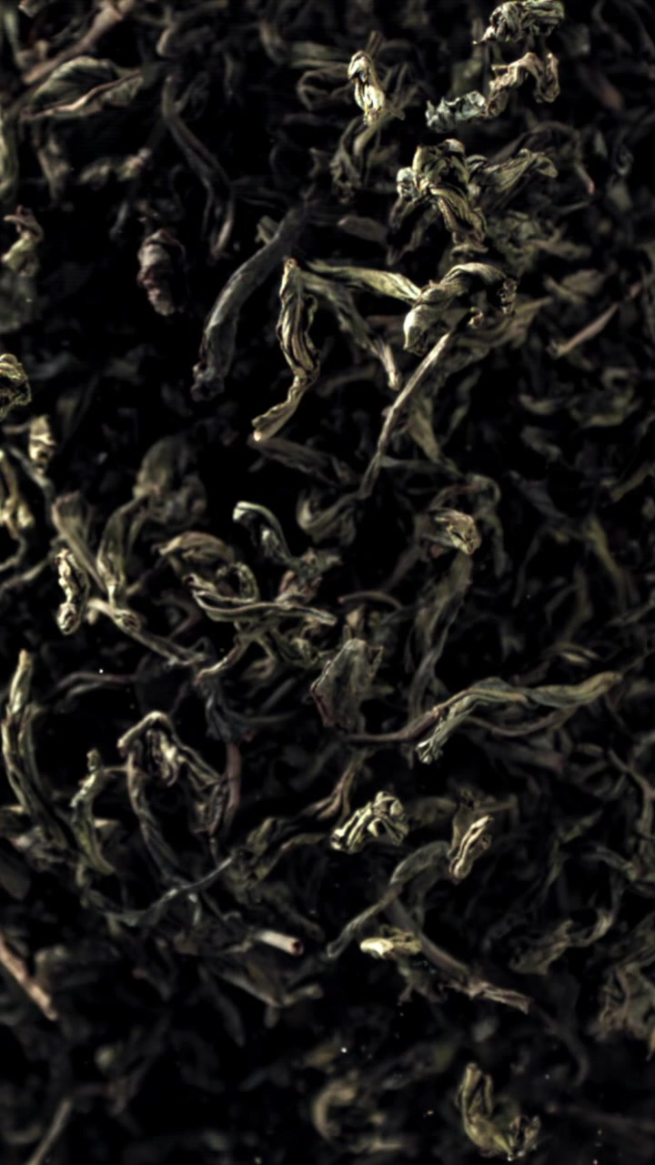 Dried Black Tea Leaves on a Dark Background