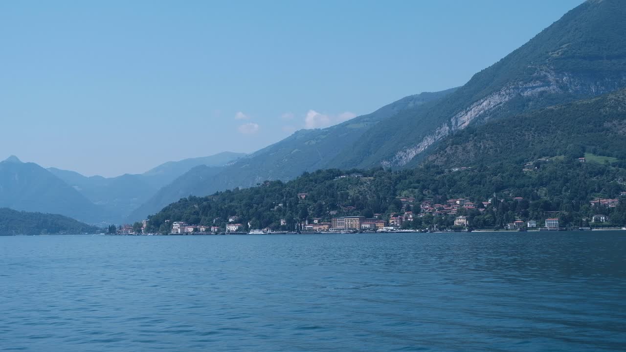 Scenic Landscape with Lake, Mountains, and Coastal Town